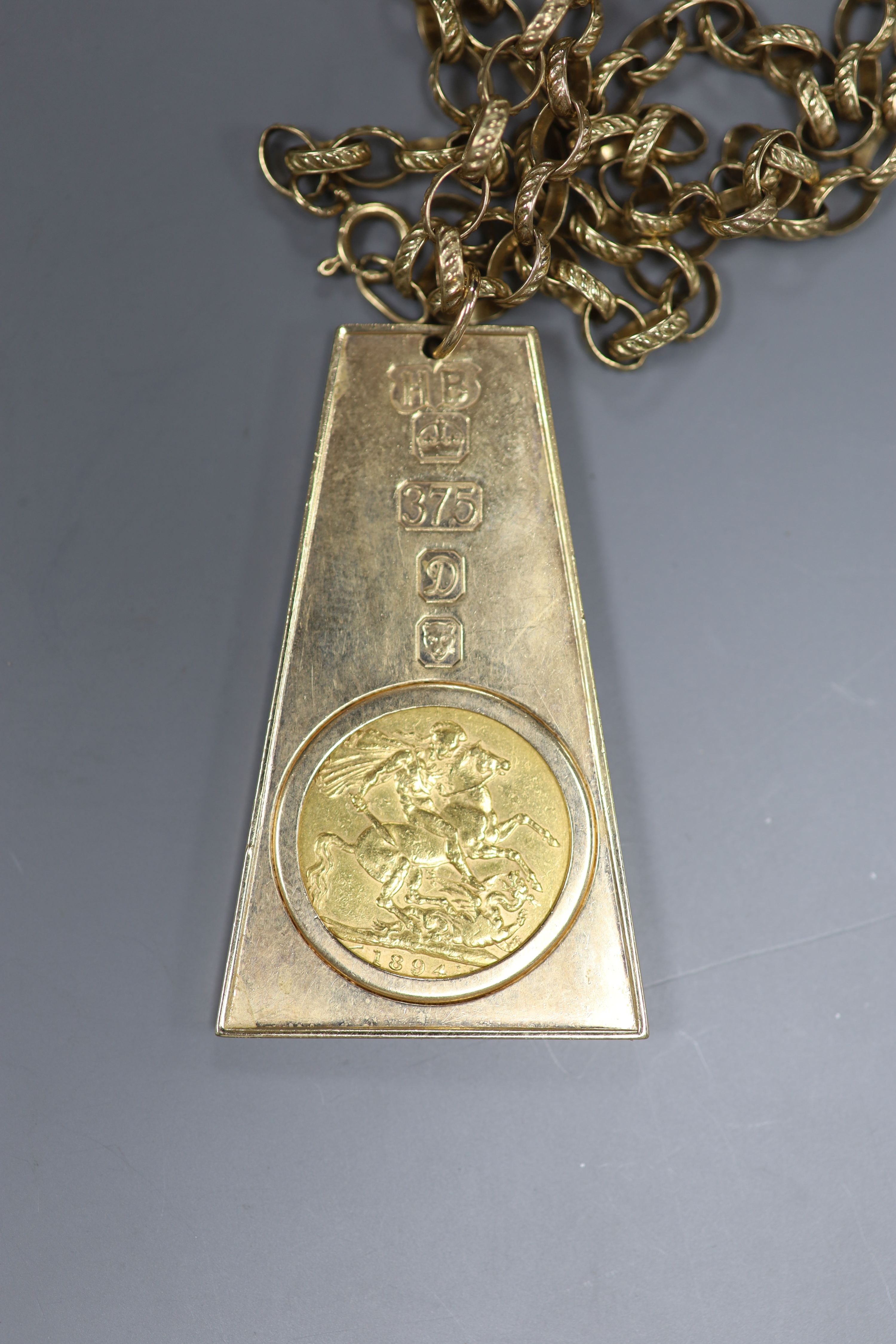 A 9ct gold ingot inset an 1894 sovereign, on 9K gold chain, gross 33g.